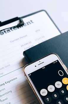 Photo of Income Statement and Calculator