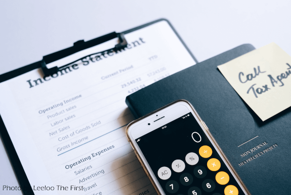 Photo of Income Statement and Calculator